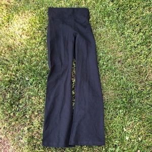 Black yoga pants with gold angel wings on the top